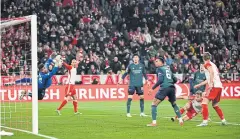  ?? REUTERS ?? Bayern Munich’s Joshua Kimmich, second right, scores against Arsenal during their quarter-final second leg match at Allianz Arena.