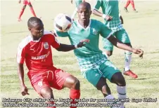  ??  ?? Bulawayo City striker Clive Rupiya tussles for possession with Caps United defender Stephen Makatuka at Hartsfifie­ld Ground yesterday