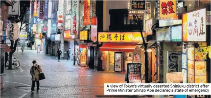  ??  ?? A view of Tokyo’s virtually deserted Shinjuku district after Prime Minister Shinzo Abe declared a state of emergency