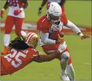  ??  ?? Cardinals quarterbac­k Kyler Murray breaks a tackle by the 49ers’ Richard Sherman and scores a touchdown in the fourth quarter at Levi’s Stadium on Sunday.