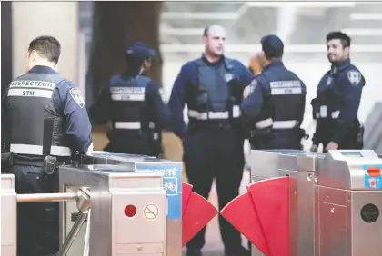  ?? ALLEN MCINNIS FILES ?? STM security inspectors gather at the Lionel-groulx métro station. A proposal by Montreal’s transit authority would give its security guards police-like powers. Some view the proposal as frightenin­g while others say it could lead to greater scrutiny of officers’ actions.