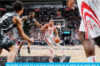  ??  ?? SAN ANTONIO: Eric Gordon #10 of the Houston Rockets handles the ball against the San Antonio Spurs on Saturday at the AT&amp;T Center in San Antonio, Texas. — AFP