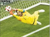  ?? Adrian Dennis / AFP / Getty Images ?? France’s goalkeeper Hugo Lloris jumps to catch the ball during Tuesday’s semifinal against Belgium.