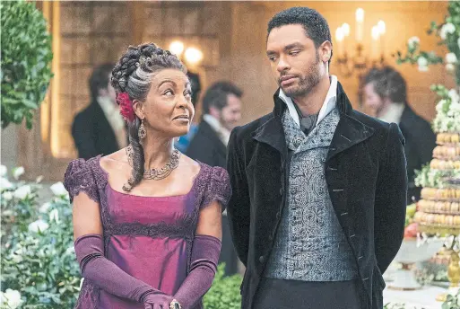  ?? LIAM DANIEL ?? Adjoa Andoh as Lady Danbury and Rege- Jean Page as Lord Hastings in the recently released Netflix series “Bridgerton,” a courtship tale set in Regency England.
