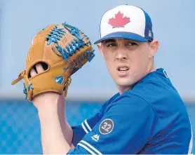  ?? — THE CANADIAN PRESS ?? Pitcher Aaron Sanchez, shown during spring training Wednesday in Dunedin, Fla., could be key to the Toronto Blue Jays’ hopes for a return to the playoffs in 2018.