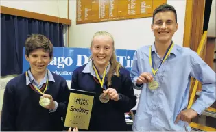  ??  ?? Winners are grinners . . . Ashburton College team members (from left) Brendan Fleming, Penny Stilgoe and Harry McMillan (all 14) celebrate their win in the spelling quiz yesterday afternoon.