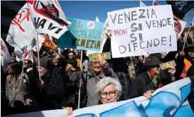  ?? Photograph: Marco Bertorello/AFP/Getty Images ?? Protesters in Venice.