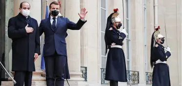 ?? | Reuters ?? FRENCH President Emmanuel Macron welcomes Egyptian President Abdel Fattah al-Sisi at the Elysee Palace in Paris during his official visit to France, yesterday.