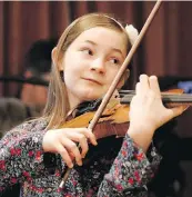  ??  ?? Alma Deutscher plays violin during a rehearsal in Vienna, Austria.