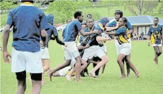  ?? Picture: ELLE MUIR ?? WEEKEND WARM-UP: Graeme College U13 player James Muir goes on the charge in their match against St Mary’s at the weekend, a warm-up for the GBS Graeme Rugby Festival which takes place in Makhanda from tomorrow