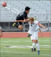  ??  ?? GILA RIDGE’S EVIS FIERRO (TOP) AND PHOENIX-CORTEZ’ NESTOR MORA (3) battle for control of the ball during the first half of the game Saturday.