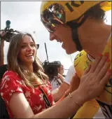  ??  ?? MY HERO: Sara Elen greets her husband Geraint Thomas at the end of yesterday’s race