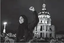  ?? Lewis Joly/associated Press ?? A demonstrat­or chants during a protest in Paris on Monday. The tensions in the political arena have been echoed on the streets.