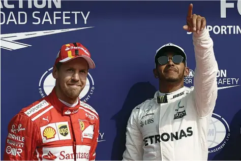  ??  ?? JOHN THYS | AFP Piloto alemão da Ferrari promete responder ao domínio evidenciad­o pelo britânico da Mercedes nas últimas quatro corridas