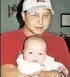  ??  ?? Zeb Stinnett holds infant daughter Victoria Jo (left), who survived after being cut from mother Bobbie Jo Stinnett (right).