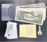  ?? CHRISTIAN ZUND/GETTY-AFP ?? Researcher­s used a clear wallet and its contents in a study of whether people decided to return lost wallets.