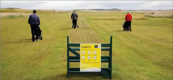  ?? Golfers adhering to the protocol guidelines keeping their distance at Castlegreg­ory Golf Club on Monday. Photo Joe Hanley ??