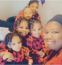  ?? HERA NOEL ?? Corneliuz Alfonso Shand Williams, 2, with his four sisters and his mother, Tabitha Frank. Frank is facing criminal charges, including manslaught­er, in connection to her son’s fatal fall from their third-floor window.