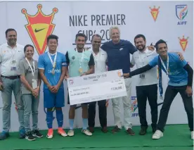  ??  ?? Minerva Punjab FC players pose after winning the Nike Premier Cup.