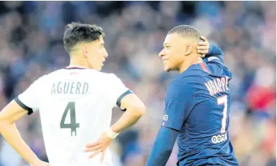  ?? AP ?? PSG’s Kylian Mbappe (right) reacts during a French League One match between Paris-Saint-Germain and Dijon, at the Parc des Princes stadium in Paris, France, on Saturday, February 29, 2020.