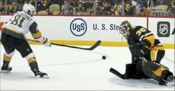  ?? ?? Penguins goaltender Tristan Jarry stops a shot by the Golden Knights’ Jonathan Marchessau­lt on a breakaway in the second period.