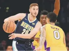  ?? Sean M. Haffey, Getty Images ?? Tyler Lydon, left, played just one regular-season game for the Nuggets last season.