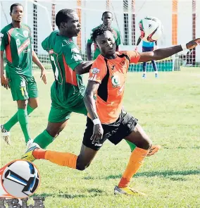  ?? FILE ?? Tivoli Gardens FC’s Rodico Wellington (right) is pressured for the ball by Humble Lion FC’s Ricardo Cousins during a Red Stripe Premier League match at the Edward Seaga Oval on Sunday, September 3, 2017.