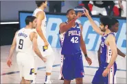  ?? KIM KLEMENT — POOL PHOTO VIA AP ?? Philadelph­ia 76ers forward Al Horford (42) celebrates with guard Furkan Korkmaz (30) during the first quarter of an NBA basketball game against the Indiana Pacers Saturday in Lake Buena Vista, Fla.