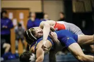  ?? NATE HECKENBERG­ER — FOR MEDIANEWS GROUP ?? Owen J. Roberts’ Connor Leister holds on against Downingtow­n West’s Grant Hanak in a win by fall at 138 pounds on Thursday night.