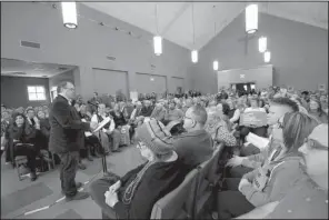  ?? Arkansas Democrat-Gazette/STEPHEN B. THORNTON ?? Glen Hooks, director of the Arkansas Sierra Club, speaks during a town-hall-style meeting to voice concerns about the administra­tion of President Donald Trump on Sunday afternoon in Little Rock.