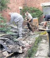  ??  ?? Clean-up operations Volunteers are hard at work