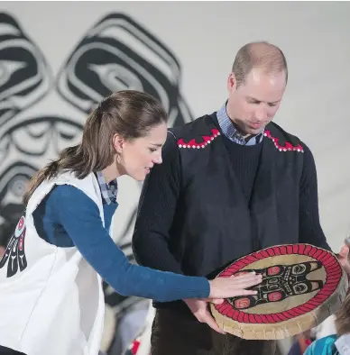  ?? DARRYL DYCK / THE CANADIAN PRESS ?? Wearing First Nations vests they were given, Prince William, Duke of Cambridge, and Kate, Duchess of Cambridge hold a traditiona­l drum at the Heiltsuk First Nation in the remote community of Bella Bella, B.C., on Monday.