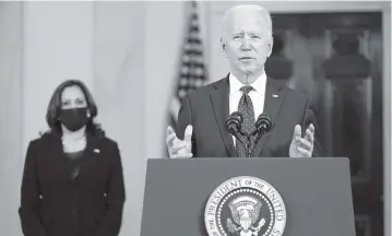  ?? EVAN VUCCI AP ?? President Joe Biden, accompanie­d by Vice President Kamala Harris, speaks Tuesday at the White House in Washington after former Minneapoli­s Police Officer Derek Chauvin was convicted of murder and manslaught­er.