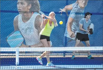  ?? Bizuayehu Tesfaye Las Vegas Review-journal @bizutesfay­e ?? Christee Chargot of Astro, Fla., returns the ball to Jean Halaham of Washington­ville, N.Y., during the 2020 Pro Pickleball Associatio­n tournament at Darling Tennis Center on Thursday.