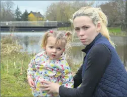  ?? (Pic: John Ahern) ?? LUCKY ESCAPE: Emma O’Driscoll and her daughter, Crystal. In the background is the pond the toddler fell into. Emma is extremely grateful to local man, Chris ‘Kipper’ O’Donovan for his role in the rescue.
