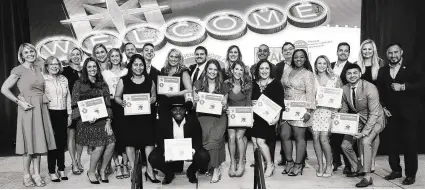  ?? Courtesy of TK Images ?? Winners of HAR’s 10th Annual Young Profession­als Network (YPN) 20 Under 40 Rising Stars in Real Estate Awards take the stage during the awards ceremony Oct. 4 at the Bayou Event Center, flanked both on the left by (left to right) 2019 HAR YPN chair Kat Robinson, HAR chair Shannon Cobb Evans and keynote speaker Leigh Brown, and on the far right by incoming (2020) HAR YPN chairman Ricardo Gonzalez.