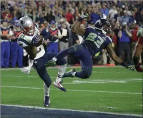  ?? KATHY WILLENS — ASSOCIATED PRESS ?? New England Patriots strong safety Malcolm Butler intercepts a pass intended for Seattle Seahawks wide receiver Ricardo Lockette in the closing seconds of Super Bowl XLIX in Glendale, Ariz., in 2015.
