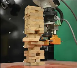  ?? RESEARCHER­S ?? To become adept at Jenga, the robot didn’t require as much practice as you might imagine.