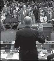  ?? AP/ALEX WONG ?? Sen. Charles Grassley (back to camera), chairman of the Senate Judiciary Committee, leads Supreme Court nominee Neil Gorsuch in taking an oath Monday before Gorsuch addressed lawmakers at his confirmati­on hearing.