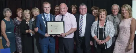  ??  ?? Supporters from Meelin celebrate being presented with the Best Village award by County Mayor Seamus McGrath at the 2016 Cork County Council Anti-Litter Challenge Awards.