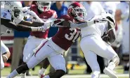  ?? NWA Democrat-Gazette/CHARLIE KAIJO ?? Arkansas defensive back Kevin Richardson tackles Tulsa wide receiver Josh Stewart during the Hogs’ 23-0 victory over the Golden Hurricane on Saturday in Fayettevil­le.