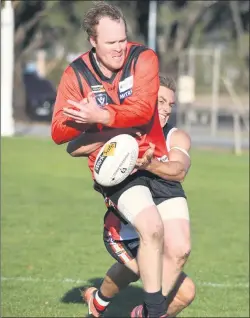  ??  ?? GOING NOWHERE: A diving tackle from Horsham Saints’ Ben Martin forces the ball from the hands of Stawell’s Todd Matthews in Wimmera Football League, and above left, Stawell’s Koby Stewart and Horsham Saints’ James Lang tangle for the ball at Horsham’s...