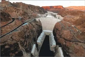  ?? Luis Sinco Los Angeles Times ?? LAKE MEAD, a main reservoir, is nearly three-fourths empty. Talks among Colorado River Basin states have stalled, and tensions remain high because Arizona and Nevada have already endured a round of cuts.