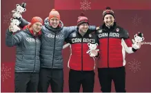  ?? REUTERS ?? The tie that binds . . . Twoman bobsleigh gold medallists (from left) Francesco Friedrich and Thorsten Margis, of Germany, celebrate with fellow gold medallists Alexander Kopacz and Justin Kripps, of Canada, during the victory ceremony in PyeongChan­g...