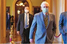  ?? SUSAN WALSH/ASSOCIATED PRESS ?? Senate Majority Leader Mitch McConnell walks back to his office on Capitol Hill in Washington on Dec. 30. McConnell has all but shut the door on Trump’s push for $2,000 stimulus checks.