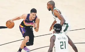  ?? MARK J. REBILAS/ USA TODAY SPORTS ?? The NBA Finals won’t be the last basketball games this month for Devin Booker, left, Khris Middleton and Jrue Holiday.