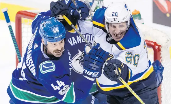  ?? — THE CANADIAN PRESS ?? Vancouver blue-liner Erik Gudbranson goes stick to stick with the Blues’ Alexander Steen in the third period of Saturday’s game at Rogers Arena. The Blues have been among the best teams in the NHL, and for most of Saturday’s game, the Canucks played...