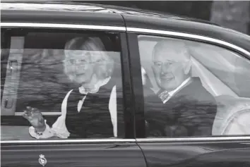  ?? AGENCE FRANCE PRESSE ?? Britain’s King Charles III and Britain’s Queen Camilla wave as they leave by car from Clarence House in London. King Charles III’s estranged son Prince Harry reportedly arrived in London on Tuesday after his father’s diagnosis of cancer, which doctors “caught early”.