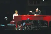  ?? AP PHOTO/KEVIN WOLF ?? Elton John, left, and Bernie Taupin perform Wednesday during the 2024 Library of Congress Gershwin Prize for Popular Song tribute concert honoring the pair at DAR Constituti­on Hall in Washington.