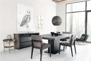  ??  ?? With today’s preference for open-concept layouts, the dining room often serves a multifunct­ional use as workspace as well. The furnishing­s in this photo, for example, can be used for both dining and home office use.